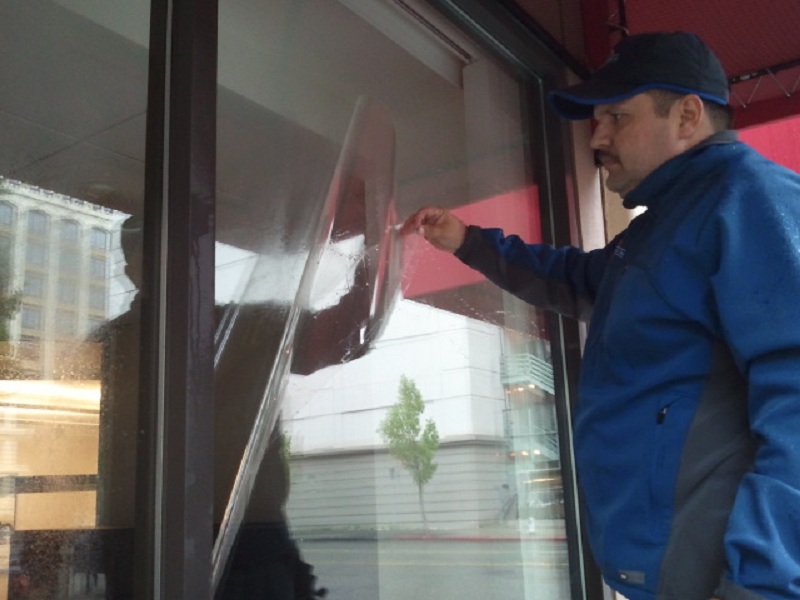 Applying Anti-Graffiti Protective Coating To Restored Glass